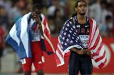 Jason Richardson looks on, Dayron Robles is disqualified by the track referee after winning the 110m Hurdles final in Daegu (Getty Images)