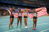 (L-R) Allyson Felix, Bianca Knight, Marshevet Myers and Carmelita Jeter of the USA celebrate victory in the women's 4x100 metres relay final  (Getty Images)