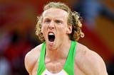 Steven Hooker of Australia celebrates his gold medal in the Pole Vault