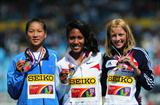 Gold medalist Ajee Wilson (USA) (c)  with Jessica Judd (GBR) (r) and silver medal winner Chunyu WANG (CHN) (l) after the Girls 800 metres final - Day Five - WYC Lille 2011 (Getty Images)