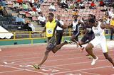 Darrel Brown, left, wins the Sagicor National Open Track and Field Championship men’s 100 metres title, at the Hasely Crawford Stadium, on Saturday. Brown clocked a windy 9.88 seconds. Richard Thompson, right, earned silver in 9.95. (Dexter Philip – Trinidad Express)