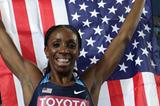 Lashinda Demus of United States celerates with her country's flag after claiming gold in the women's 400 metres hurdles final  (Getty Images)
