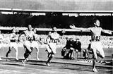 John Landy (AUS) takes the 1500m bronze behind Ron Delany of Ireland at the 1956 Olympics (Getty Images)