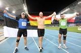 Robert Harting of Germany celebrates victory in the Men's discus final with Gerd Kanter of Estonia (L) and Ehsan Hadadi of Iran (R) during day four  (Getty Images)
