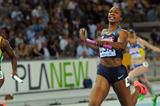 Carmelita Jeter of the USA crosses the finish line to claim victory ahead of Veronica Campbell-Brown of Jamaica in the women's 4x100 metres final  (Getty Images)