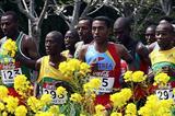 Tariku Bekele runs behind Kidane tadasse Habteselassie of Eritrea in the junior men's race (Getty Images)