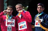 Gold medalist Valeriy Borchin of Russia (c) celebrates with silver medalist Vladimir Kanaykin (l) and Luis Fernando Lopez of Columbia after the mens 20k walk during day two  (Getty Images)